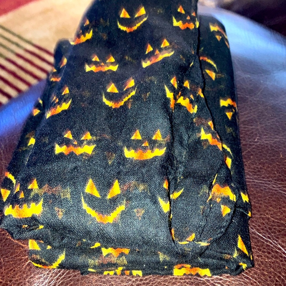 Lightweight jack o lantern face scarf.
